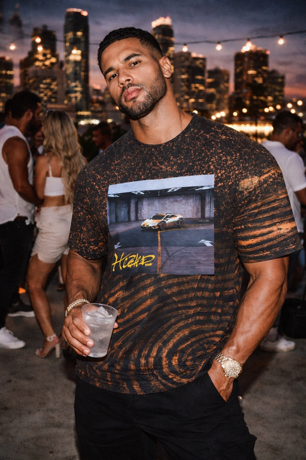Man wearing a graphic t-shirt with a cityscape background