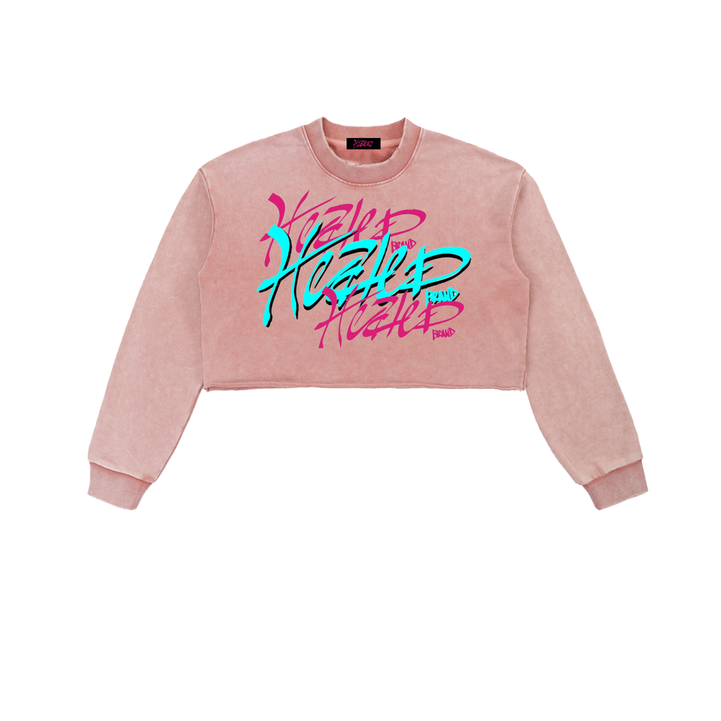 Pink cropped sweatshirt with colorful text design on a white background